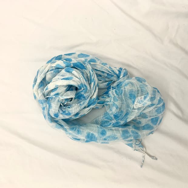 A light blue sheer scarf