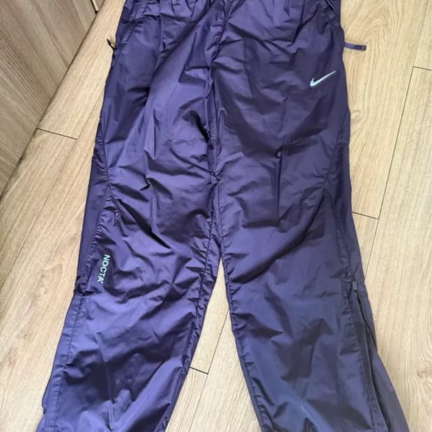 Nike Drake Nocta 다크레이즌 트랙팬츠 개급처