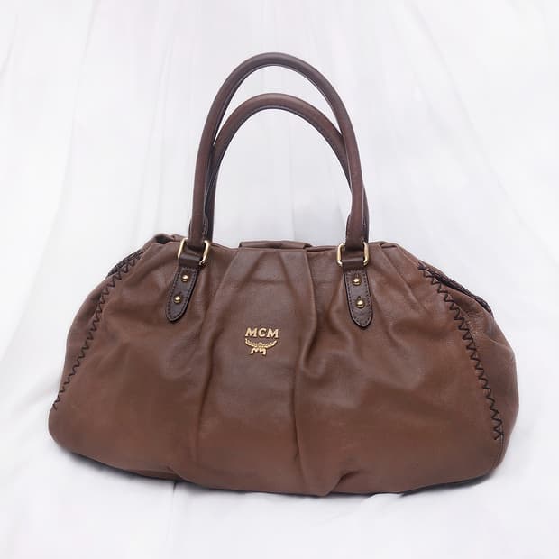 MCM 브라운 카프스킨 셔링 레더 토트백.보스턴백