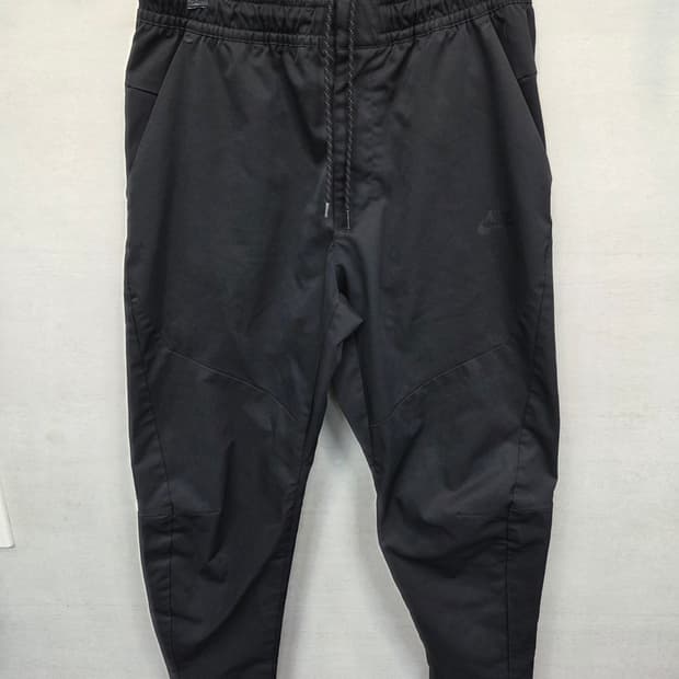 나이키 언라인드 커뮤터 테크 우븐팬츠 L