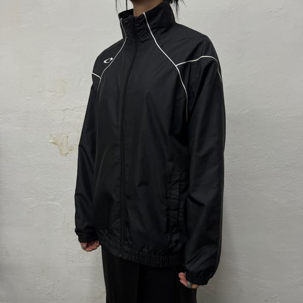 오클리 블랙 파이핑 양면 서클 로고 폴리에스터 하이넥 집업 윈드브레이커