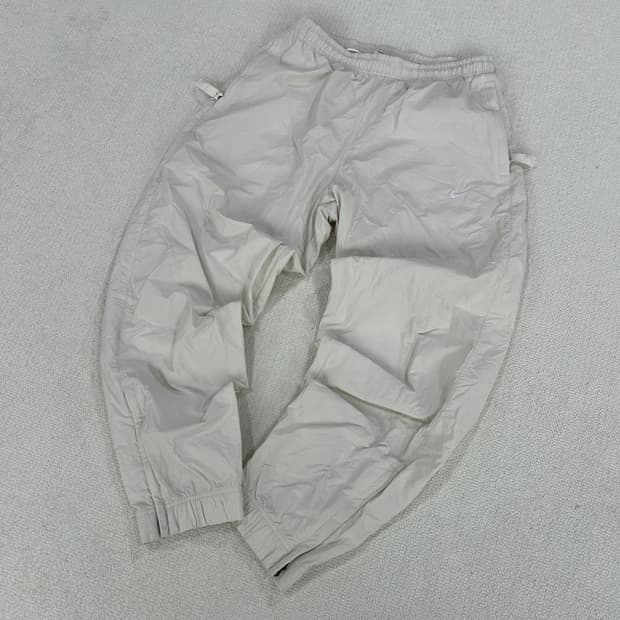 나이키 바람막이 재질 조거팬츠