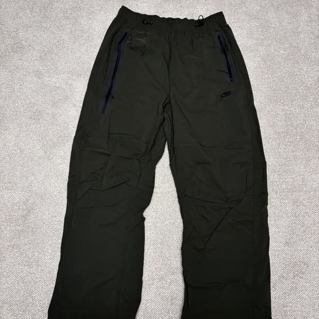 [NIKE] 테크 우븐 오픈 헴 오버사이즈드 팬츠