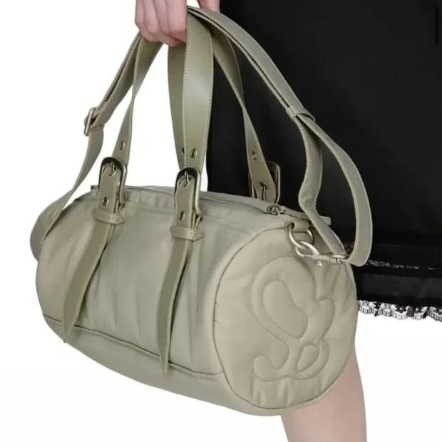 썬번프로젝트 Padded Symbol Travel Bag