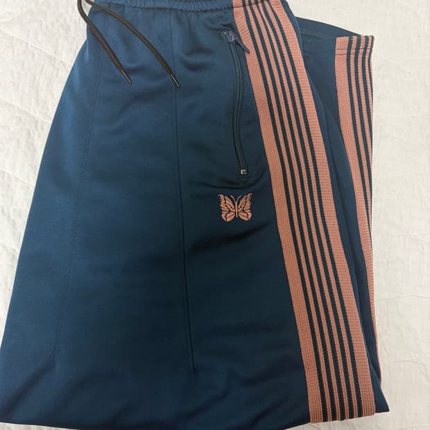 니들스 HD 트랙팬츠 틸 그린
