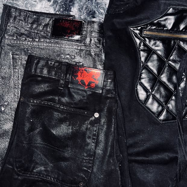 emostance) multi distressed coated jean
