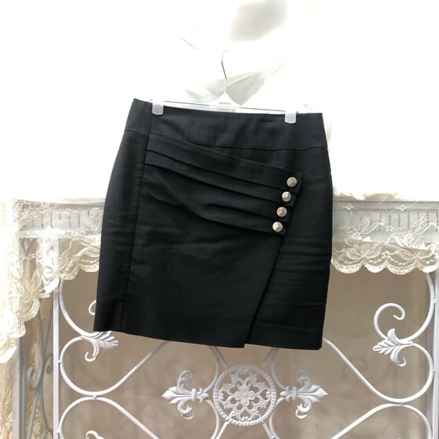 black asymmetric button mini skirt