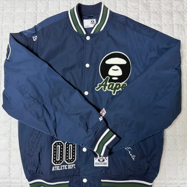 aape 바시티 자켓