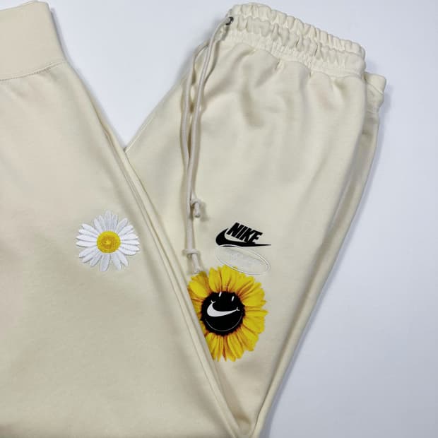 나이키 스우시 플라워 라이트 옐로우 조거팬츠 (L)