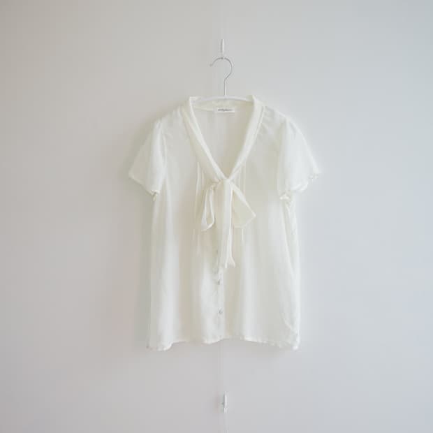 Pale ivory fluid tie blouse