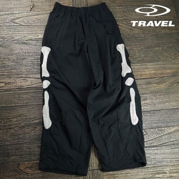 [트래블] 스켈레톤 나일론 와이드 팬츠 블랙 M19133