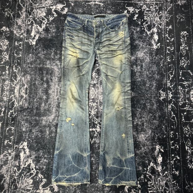 Fuga pierced distressed boots cut denim