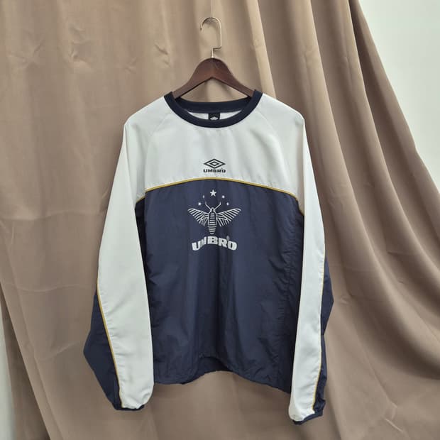 엄브로 우븐 피스테 웜업 바람막이 110