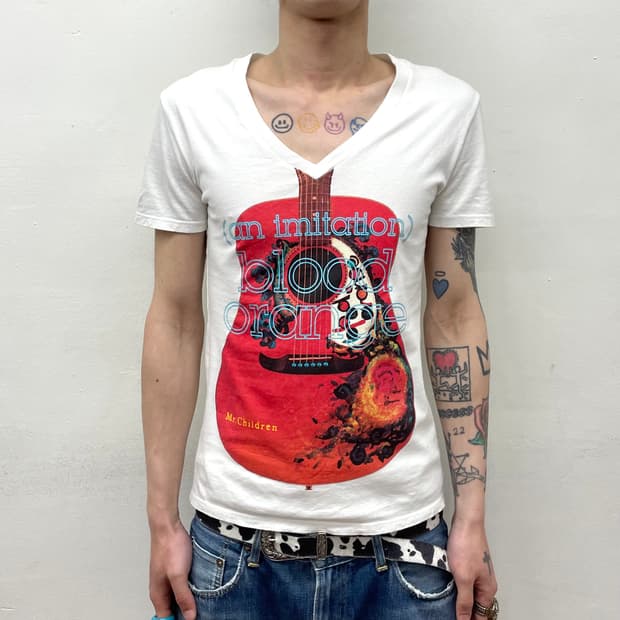 red guitar white T-shirt