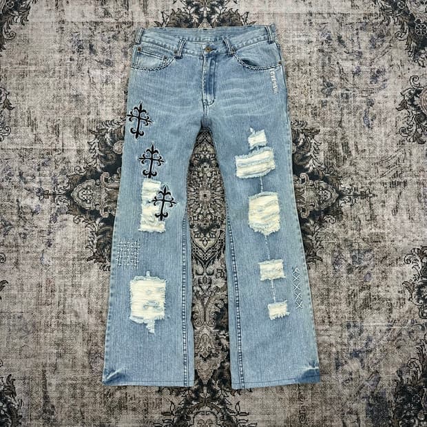 Cross embroidery damaged denim pants