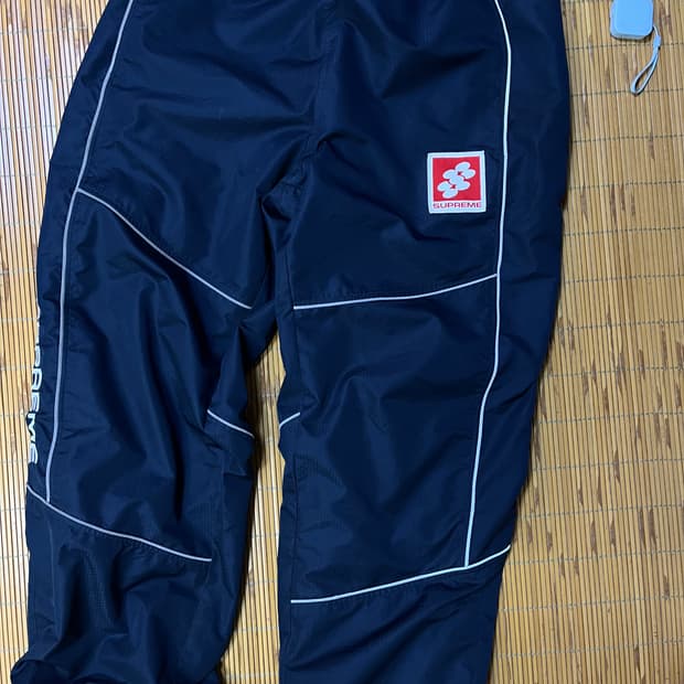 Supreme reflective piping track pants