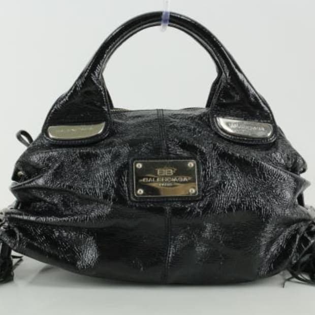 발렌시아가 블랙 가죽 태슬 가방