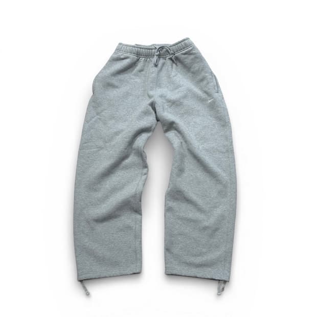 Nike NSW 솔로 스우시 오픈 헴 플리스팬츠