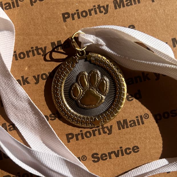 90s vtg Paw Medal