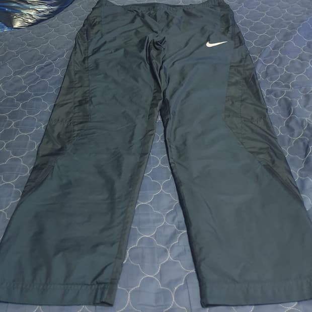 (09s) 나이키 스톰핏 솔로스우시 밑단집업 와이드 트랙팬츠 (L)