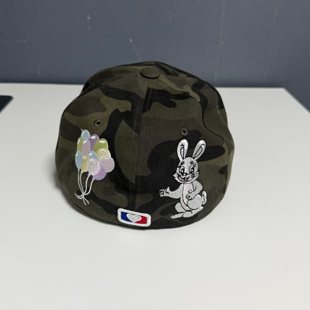 더뮤지엄비지터 래빗 캡