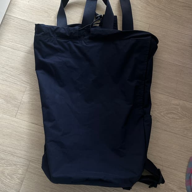 유니클로U 르메르 콜라보 드로스트링 백팩 네이비