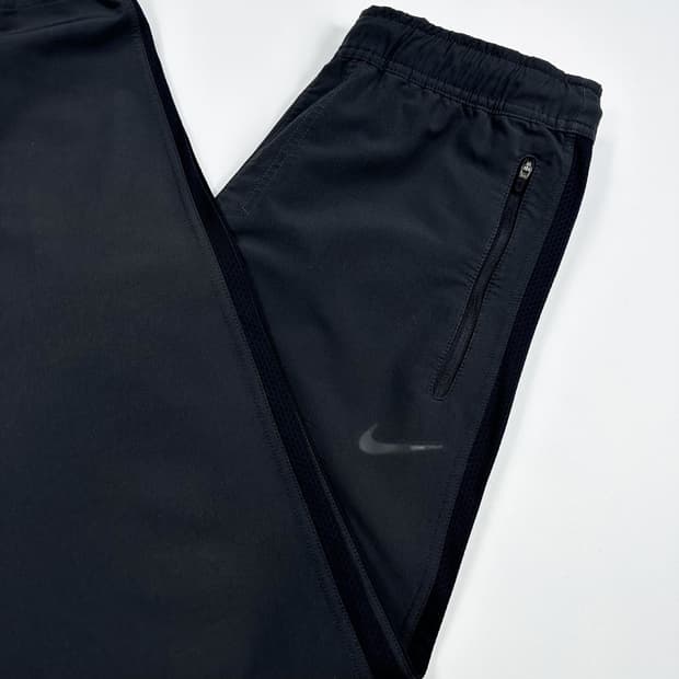나이키 스우시 런닝 차콜 우븐팬츠 (M)