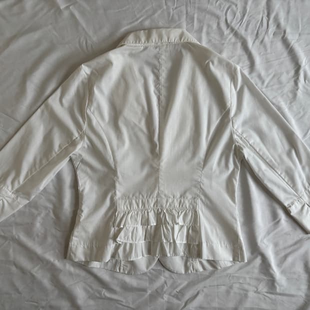 white jacket, back ruffle detail