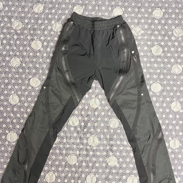 언더마이카 트위스트 지퍼 라인 테이핑 팬츠 0