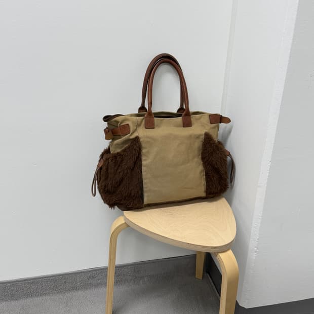 Zucca canvas fur trimmed bag