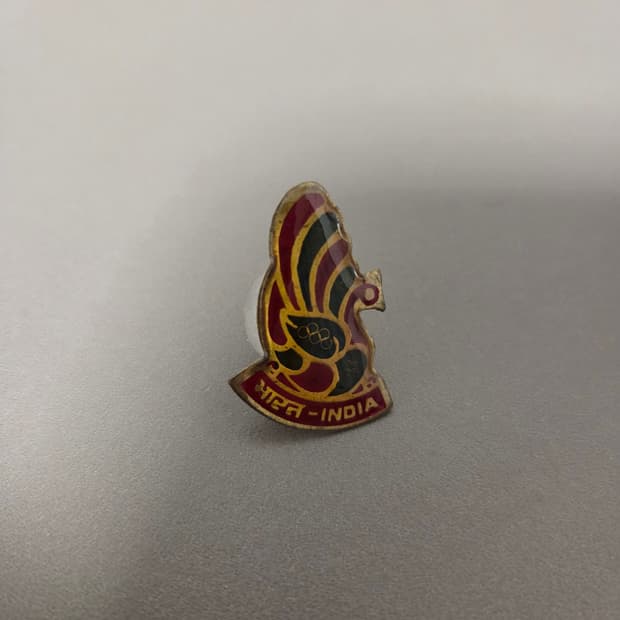 인도 올림픽 협회 공작새 뱃지