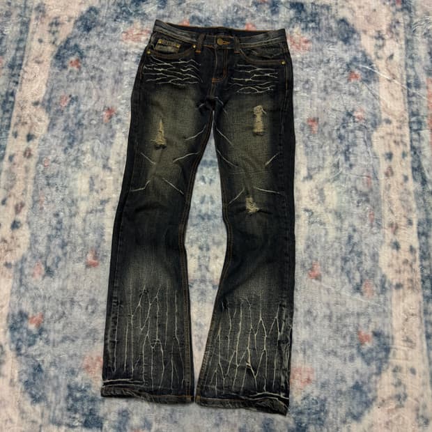 Black baccara wave washed boot cut denim
