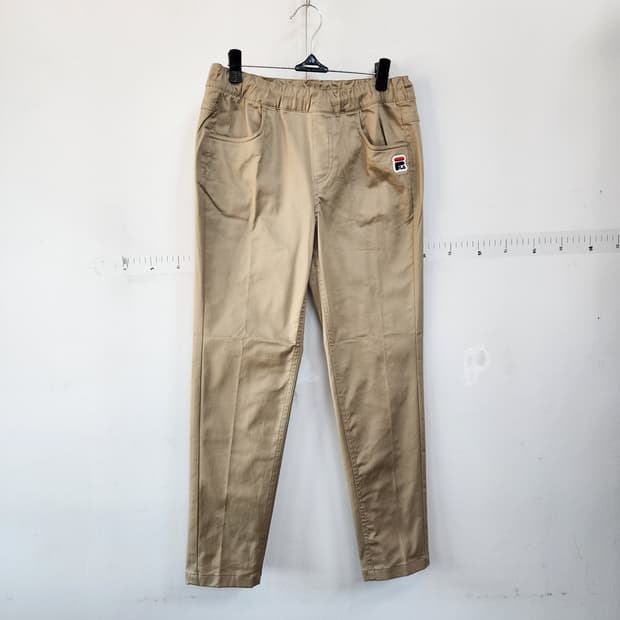  휠라 아동 베이지색 면바지