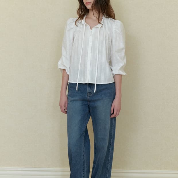 among PINTUCK RUFFLE DETAIL BLOUSE