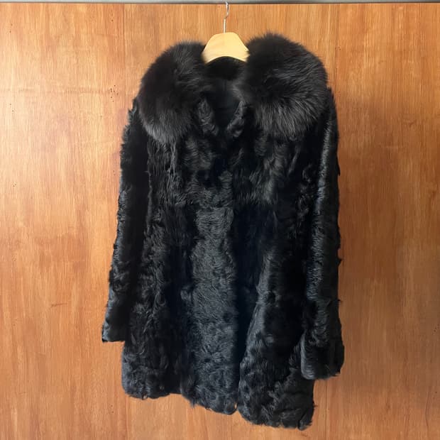 Black curly fur coat