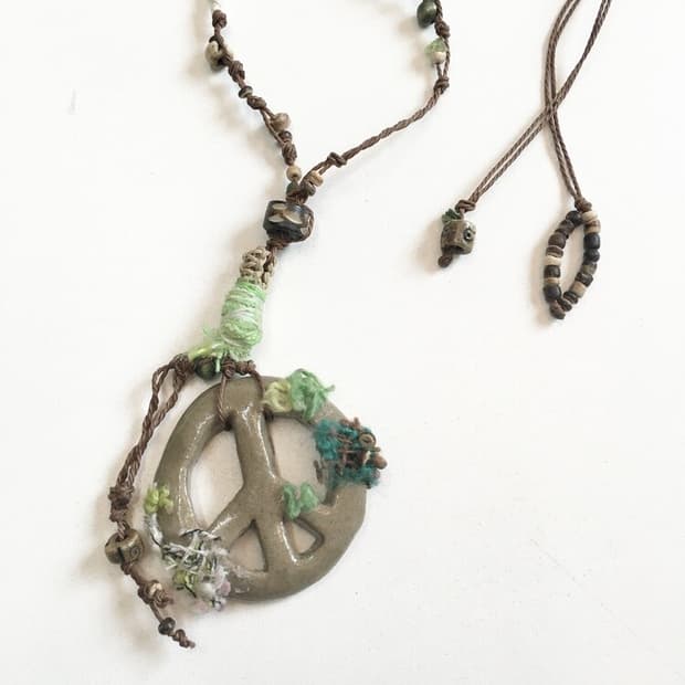 molded peace necklace