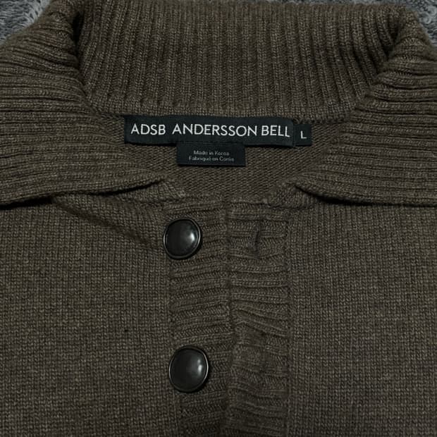 앤더슨벨 컷아웃 폴로 스웨터