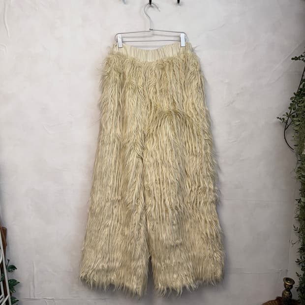 Ivory grunge fur over pants 