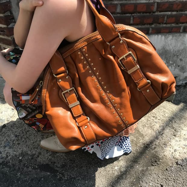 Michael Kore brown buckled leather bag
