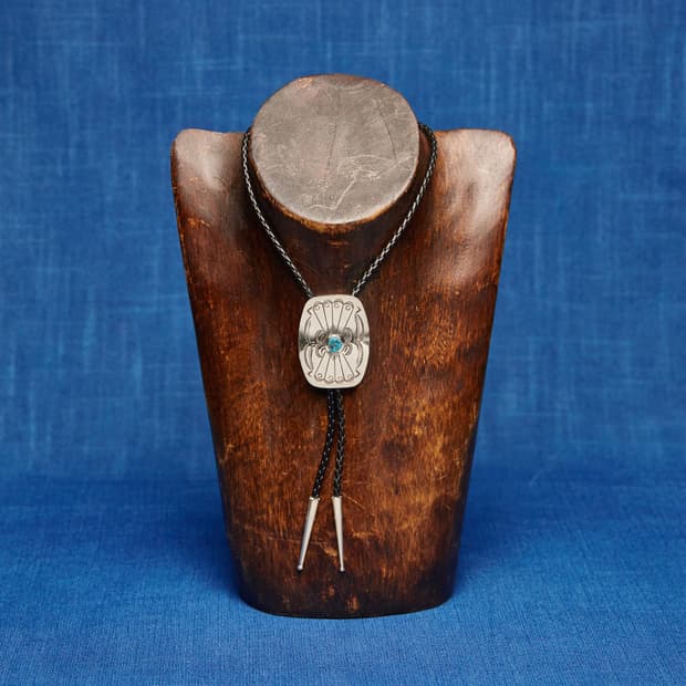 STAMPED TQ CONCHO BOLO TIE