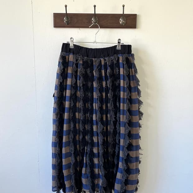 RAPUCALUSON 테슬 체크 스커트