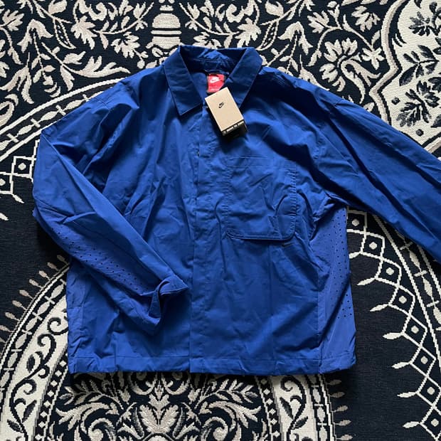 나이키 NSW 스포츠웨어 테크 맨즈 버튼 다운 탑