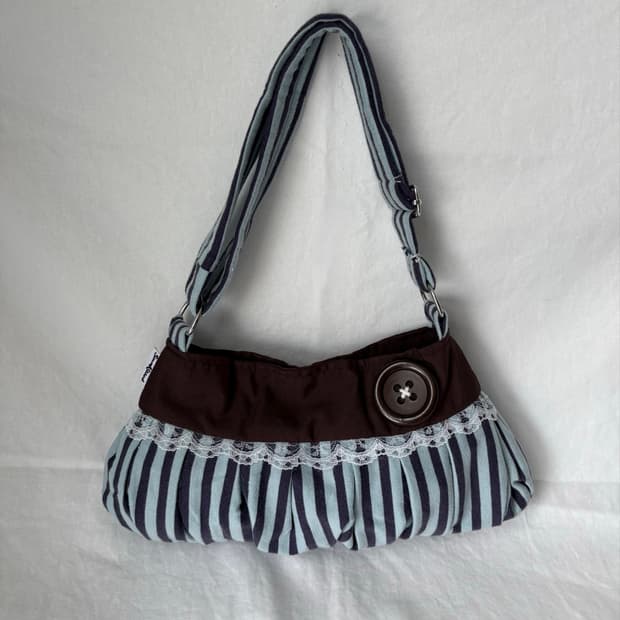 Coraline button shoulder bag