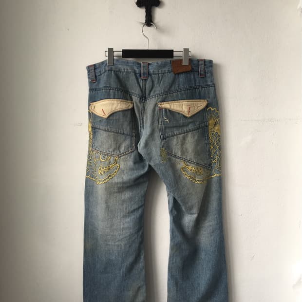 Back needle work point denim pants
