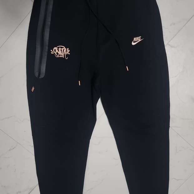 나이키 시나월드 테크팩 바지