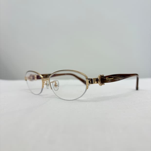 FERRAGAMO 페레가모 골드 오벌형 반무테