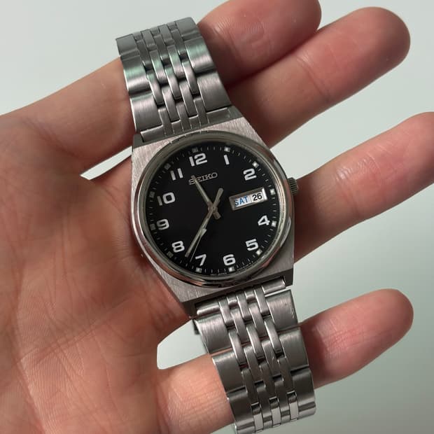 1980s Black Dial Arabic Silver Quartz