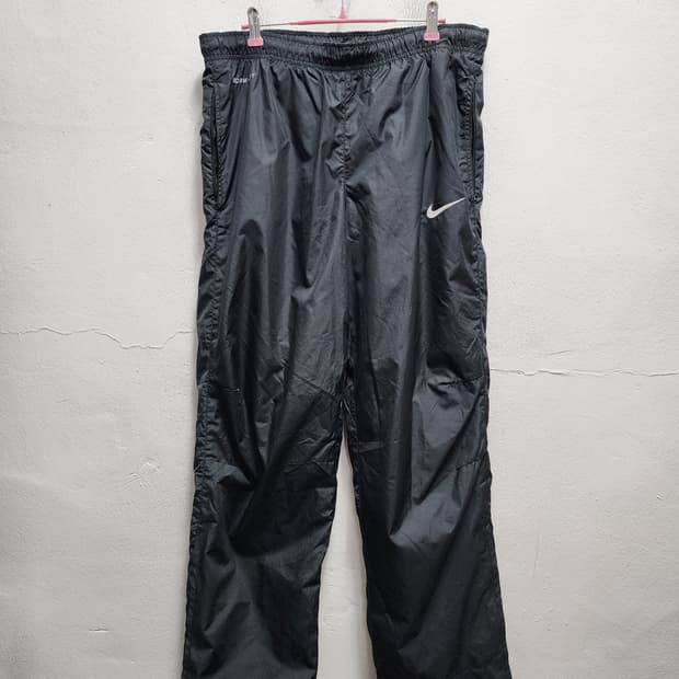 나이키 스톰핏 와이드 나일론 팬츠