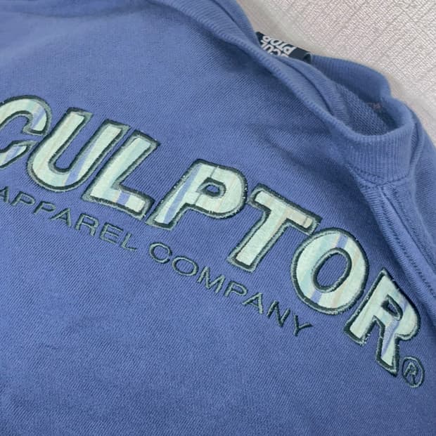 스컬프터 로고 체크패치 맨투맨