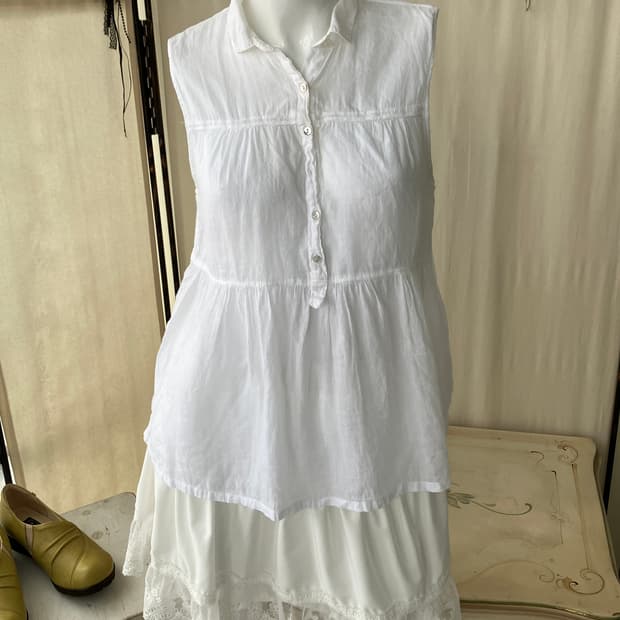 white frill sleeveless blouse